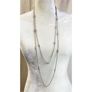 Express long double strand silver tone necklace with clear rhinestone accents